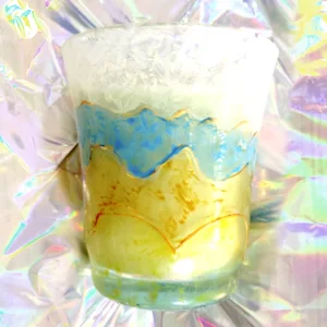 Detalle vela creada y decorada por SúperL en vaso de vidrio.
